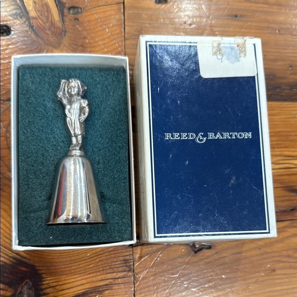 Reed & Barton Silver Bell with Toddler holding a sock